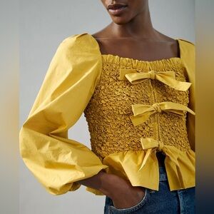 K1. Mare Mare Anthropologie Tilly Smocked Bow-Tie Blouse in Yellow